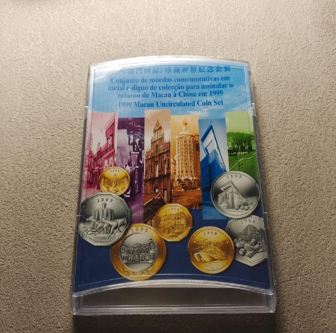 Close view of the seven 1999 Macau handover coins in the bilingual display card
